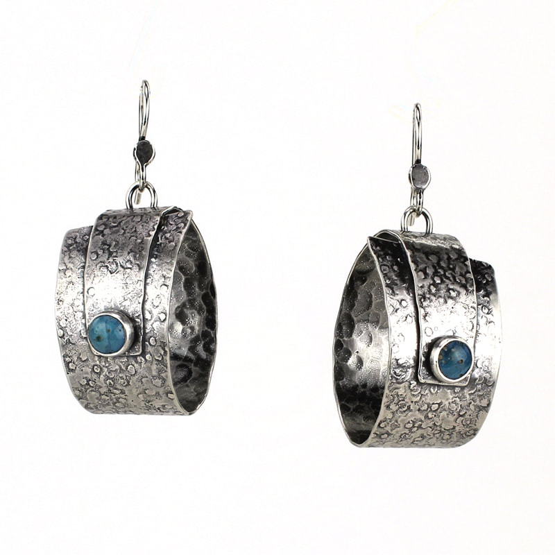 Textured and oxidized handmade silver chunky hoop earrings with leland blue stones.